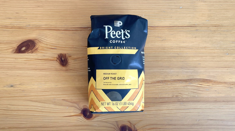 Peet's coffee bag lying on wooden surface