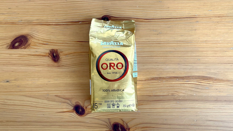 Lavazza coffee bag lying flat on wooden table