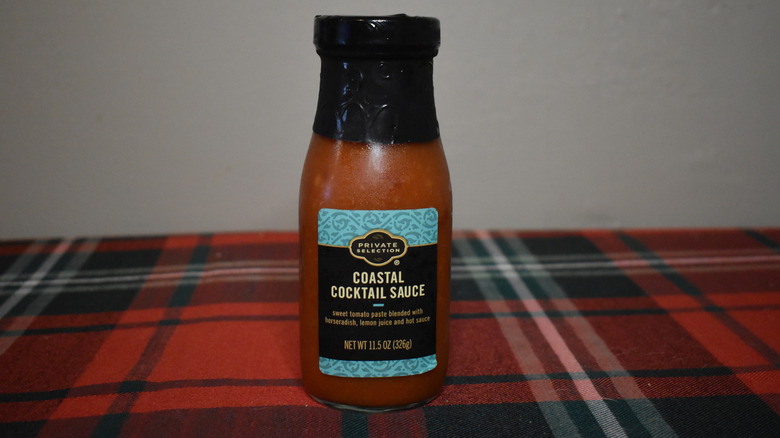 blue, black and gold coastal cocktail sauce bottle