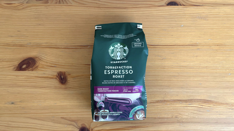 Starbucks coffee bag lying flat on wooden table