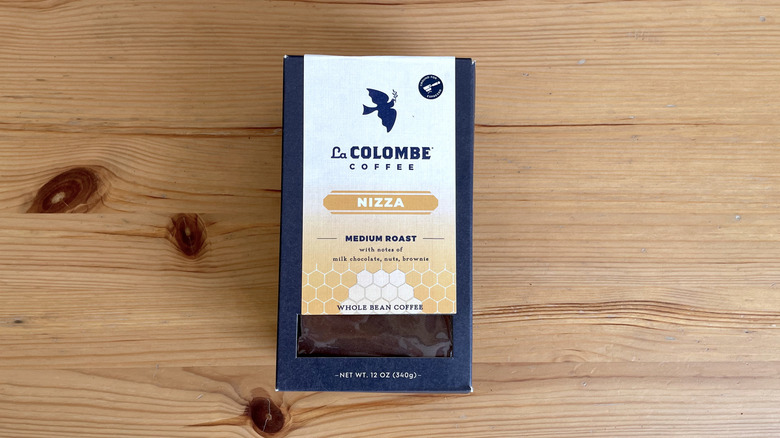 La Colombe coffee bag lying flat on wooden table