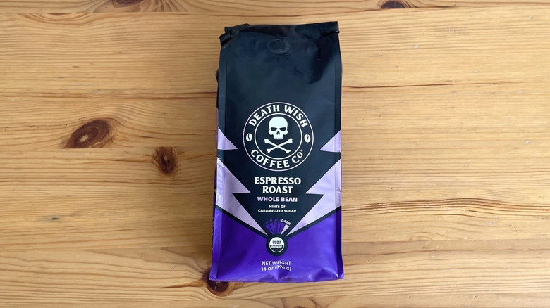 Death Wish coffee bag lying flat on wooden table