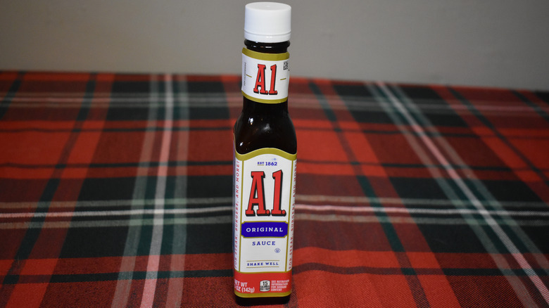 small A.1. bottle on plaid table