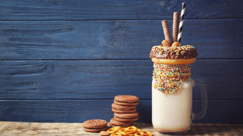 Milkshakes glasses with straws and garnish