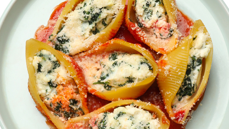 Shells stuffed with ricotta and spinach on a white plate