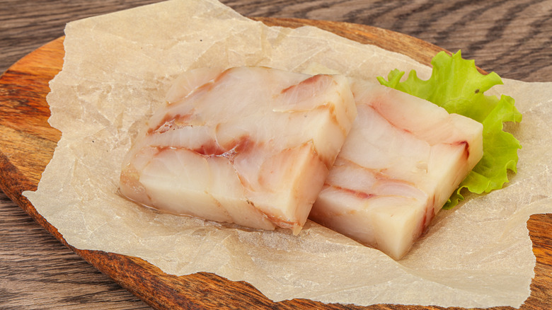 Alaska pollock fillets on cutting board