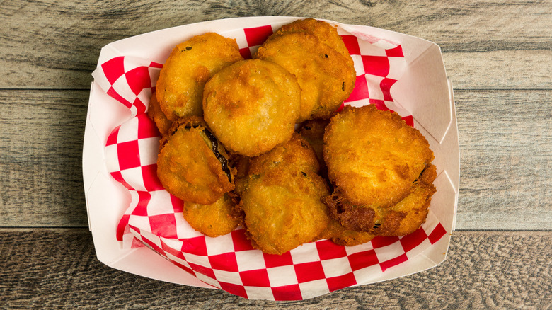 Fried pickles in small paper basket