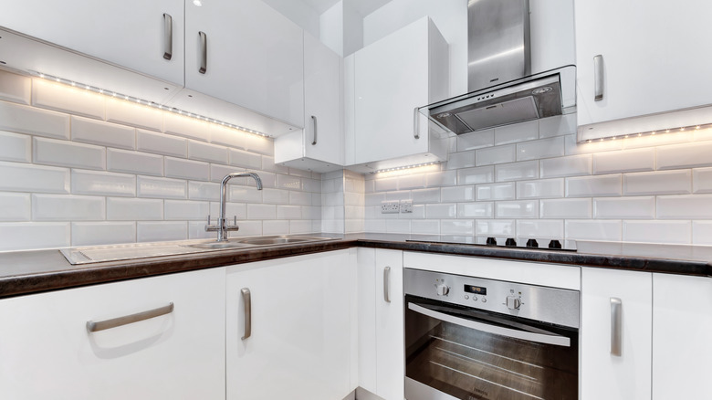 Modern kitchen with white tile backsplash
