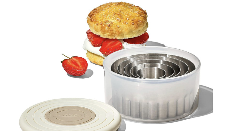 A strawberry shortcake and a set of biscuit cutters