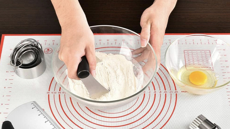 A woman baking biscuits
