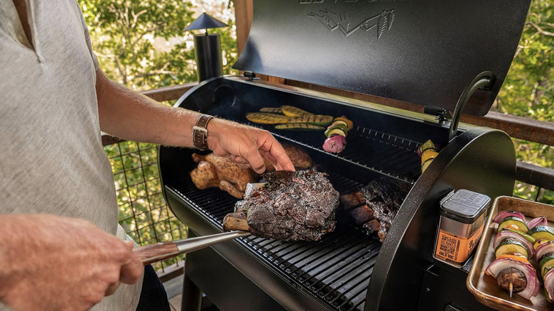 Man cooking ribs on a Traeger Grills Pro 780