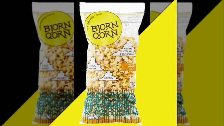 A bag of BjornQorn popcorn on a yellow background