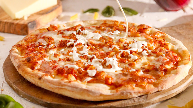 Buffalo chicken pizza with ranch drizzle