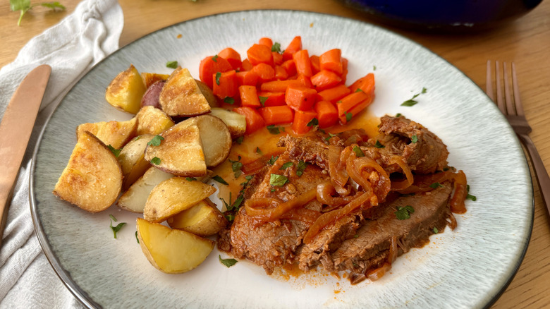 Dinner plate with brisket, carrots, and potatoes
