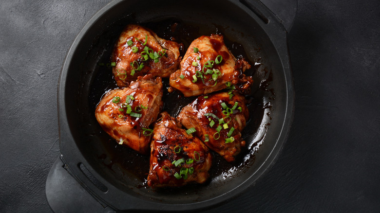 Chicken thighs in adobo sauce with scallions