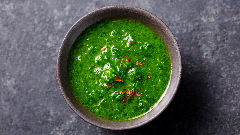 Chimichurri sauce in a brown bowl