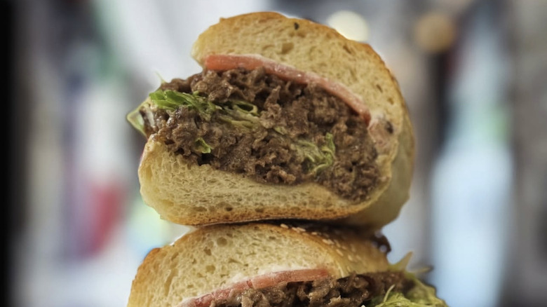 Two chopped cheese sandwiches