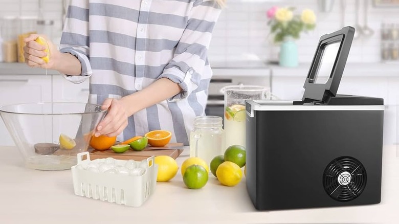 Person making juice with ice