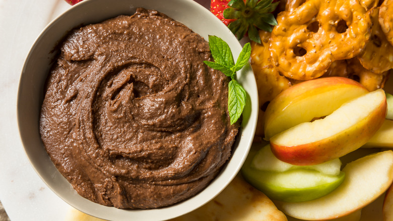 Chocolate dessert hummus with pretzels and fruit