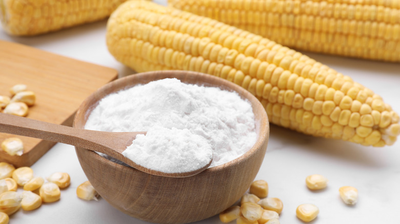 Corn starch with corn cobs in background