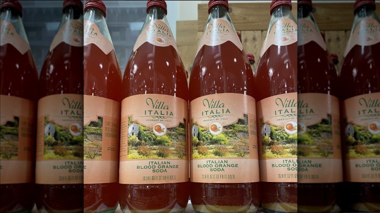 Bottles of Trader Joe's Villa Italia Blood Orange Soda on store shelf