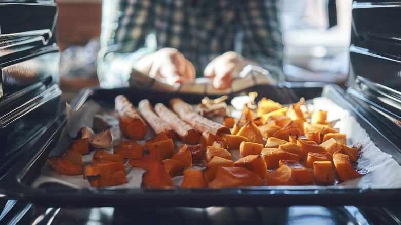 Pan of vegetables in oven