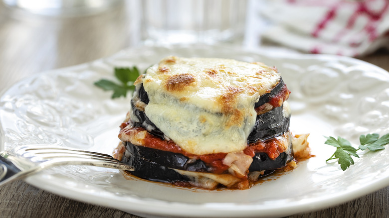 Eggplant parmigiana on a white plate