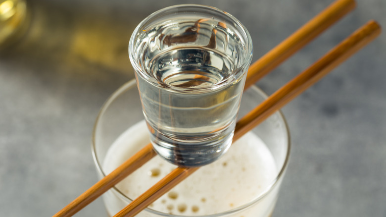 Soju bomb, shot glass of soju and beer glass