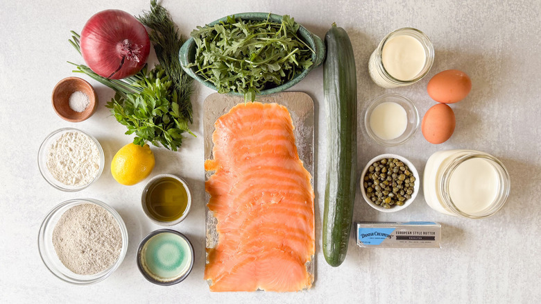 Buckwheat crepes with salmon and homemade creme fraiche ingredients on countertop