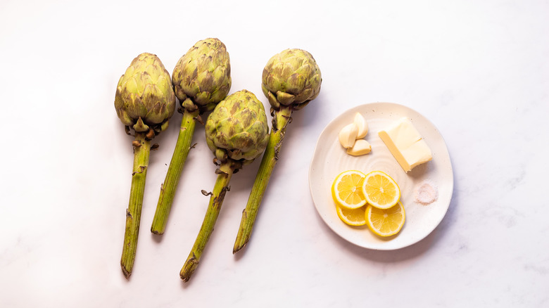 steamed artichoke ingredients on table
