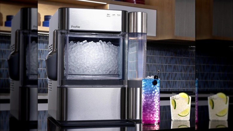 GE ice machine with water container on kitchen countertop