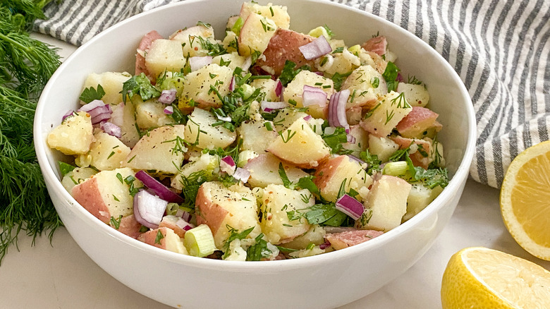 white bowl of potato salad