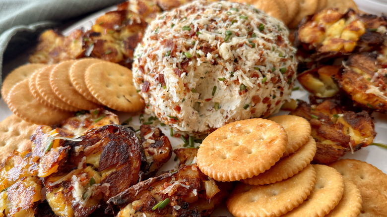 Loaded potato cheese ball on platter