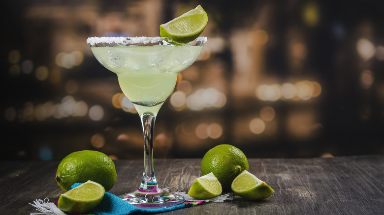margarita on a table with lime