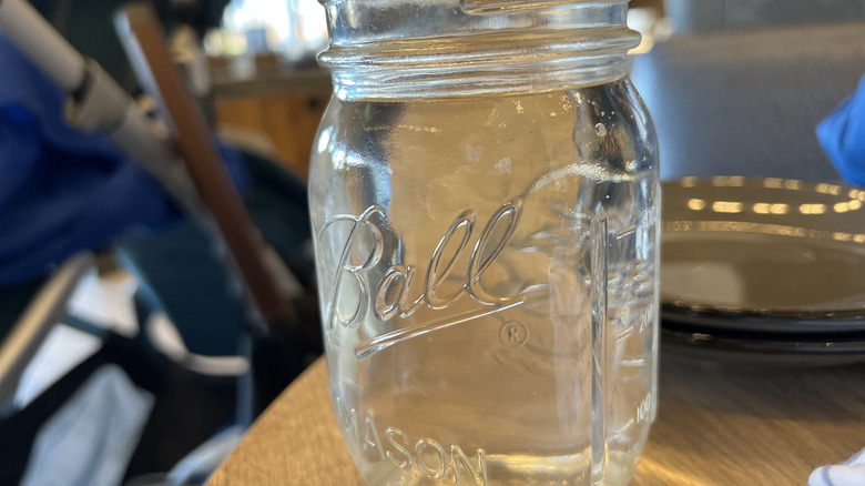 An empty Ball Mason jar.