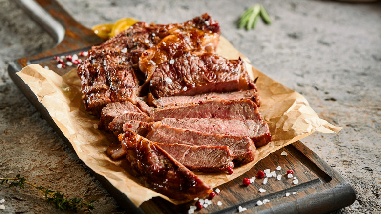 A steak cut into slices that go against the grain