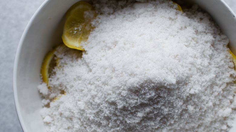 Lemons in a bowl with sugar