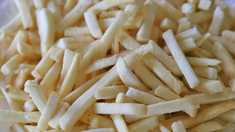 A pile of frozen french fries