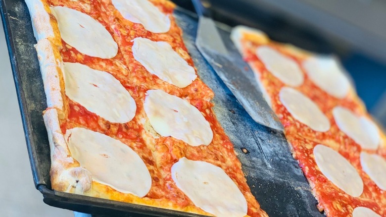 Pizza slices with extra cheese from Cristy's in Salisbury, Massachusetts