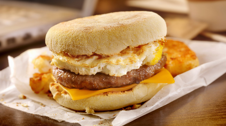 Egg, sausage, and cheese breakfast sandwich on English muffin