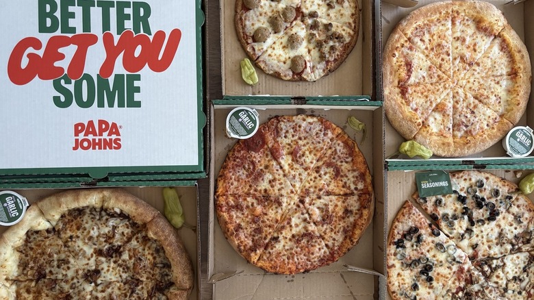 overhead view of Papa Johns pizza box and pizzas