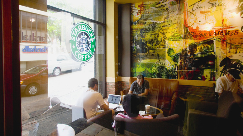 Customers sitting inside a Starbucks coffee shop