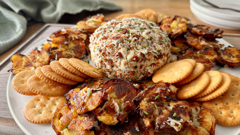 Cheese ball with smashed potatoes and crackers