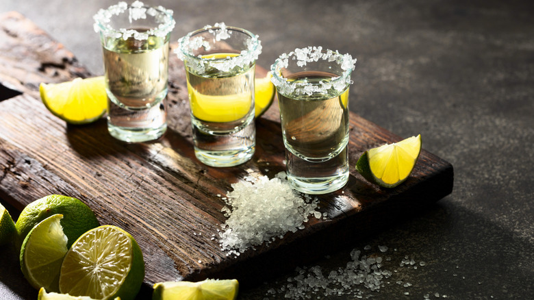 three tequila shots with salt and lime