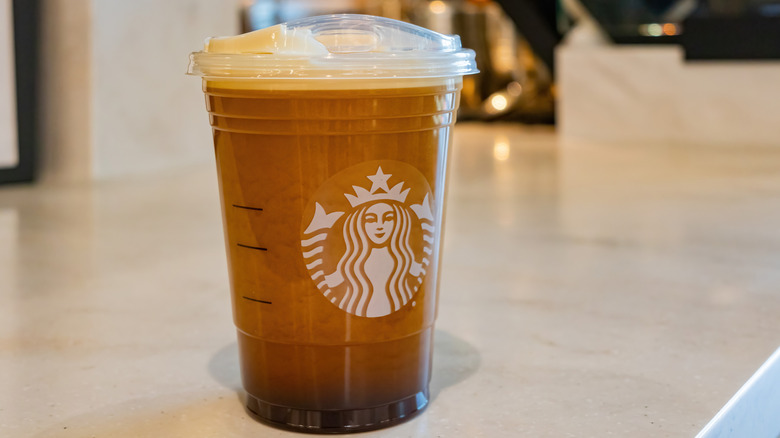 A cup of Starbucks nitro cold brew on a countertop
