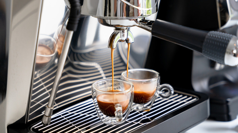 Espresso machine pouring two cups of espresso
