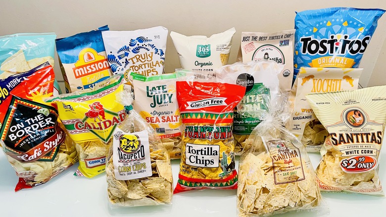 Assorted bags of tortilla chips on counter