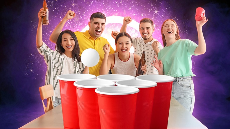 Red solo cups and people cheering while drinking beer