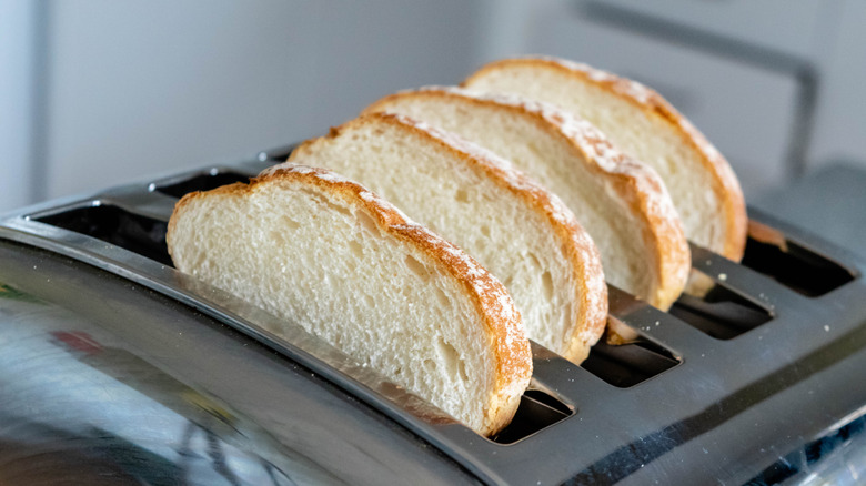 4-slice toaster with four slices of white bread