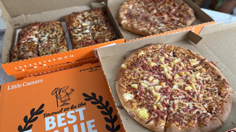 Little Caesars pizzas arranged in orange boxes